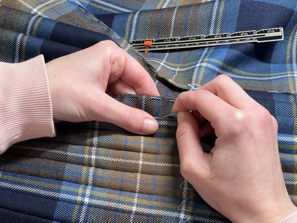 Each pleat is measured and hand-sewn accurately